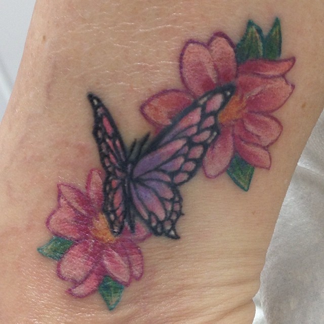 Tiny butterfly and cherry blossoms